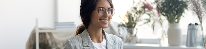 woman wearing glasses smiling