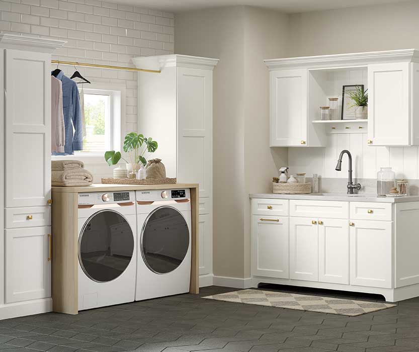 laundry room with white cabinetry